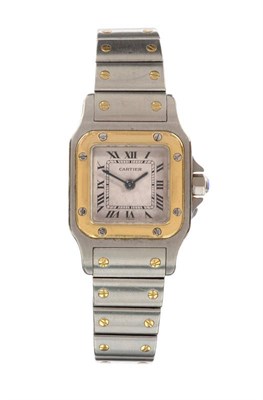 Lot 655 - A Lady's Bi-Metal Quartz Wristwatch, signed Cartier, Model: Santos, circa 1995, quartz...