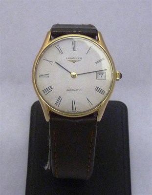 Lot 667 - A 9ct Gold Automatic Calendar Wristwatch, signed Longines, circa 1990, self-winding lever movement