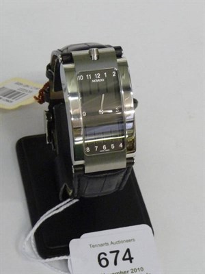 Lot 674 - A Stainless Steel Curved Quartz Wristwatch, signed Movado, circa 2008, quartz movement, black...