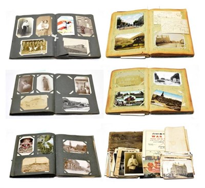 Lot 334 - Vintage Postcards - A fascinating collection in three old albums and in envelopes. Mainly...