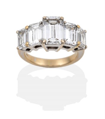 Lot 53 - A Diamond Five Stone Ring, set with graduated emerald cut diamonds in white claw settings, on a...