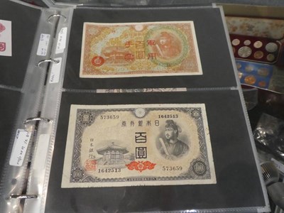 Lot 207 - An album of World banknotes including notes from Russia, China, Indonesia, Hungary, France, Greece