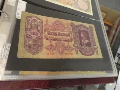 Lot 207 - An album of World banknotes including notes from Russia, China, Indonesia, Hungary, France, Greece