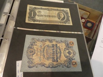 Lot 207 - An album of World banknotes including notes from Russia, China, Indonesia, Hungary, France, Greece