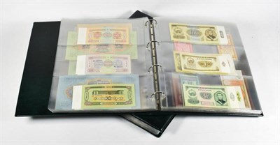 Lot 208 - An album containing approx. 124 banknotes from Uzbekistan, Khazakhstan, Kyrgyzstan, Mongolia,...