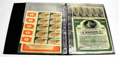 Lot 215 - An album of Russian banknotes and bonds including Russia Joint Stock Company Tobacco Factory,...