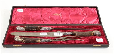 Lot 31 - A cased Victorian three piece silver mounted antler handled carving set, by J.M.Potter,...