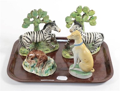 Lot 35 - A pair of Staffordshire zebras and two Continental dogs