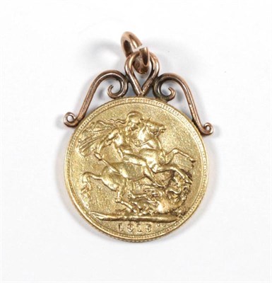 Lot 50 - A 1915 George V gold sovereign, with soldered attached frame