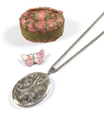 Lot 53 - A pink enamelled butterfly brooch, by David Anderson (a.f.); and a silver locket by Georg...