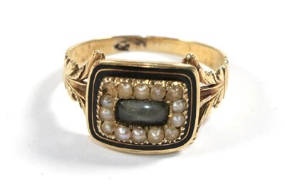 Lot 99 - A George III enamel and seed pearl mourning ring, with inscription and dated 1828, finger size O1/2