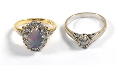Lot 102 - An 18 carat white gold solitaire diamond ring, finger size M1/2; and an opal and diamond...