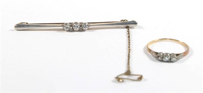 Lot 108 - An Edwardian diamond three stone bar brooch, stamped '15CT', length 5.7cm; together with a...