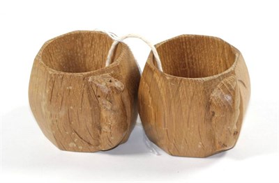 Lot 116 - Mouseman: Two Robert Thompson of Kilburn English oak napkin rings, of octagonal form, each with...