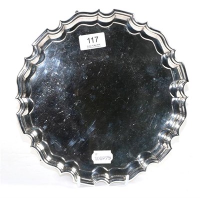 Lot 117 - A shaped circular silver salver, Walker & Hall, Sheffield 1925, 25.5cm diameter, 15.2ozt