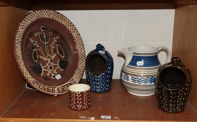 Lot 157 - A Wattisfield pottery slip ware dish, two Wetherigg pottery salt cellars, a similar pot and a...