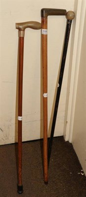 Lot 159 - Three early 20th century horn handled walking canes
