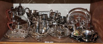 Lot 172 - A shelf of silver plated items including a tea set, stirrup cup, entree dishes and covers,...