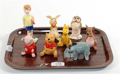 Lot 178 - A set of eight Beswick Walt Disney Winnie the Pooh models