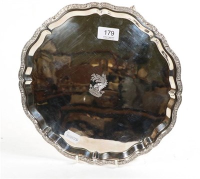 Lot 179 - A shaped circular silver salver, Camelot Silverware, Sheffield 1999 the centre engraved with a...