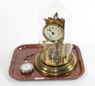 Lot 180 - An anniversary timepiece under a glass dome and a Waltham silver plated pocket watch (2)