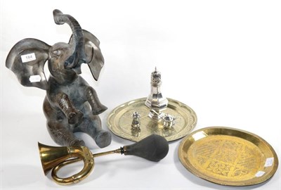 Lot 184 - A bronze figure of an elephant; two Nigerian platters; a brass horn with rubber bulb; a plated...