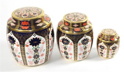 Lot 193 - A graduated set of three Royal Crown Derby Imari ginger jars and covers, tallest 22cm