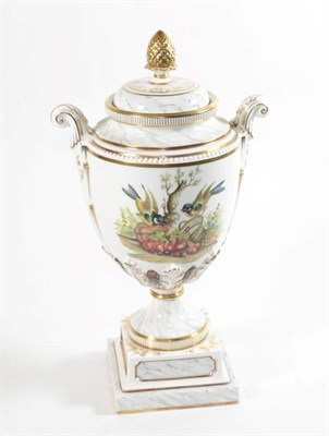 Lot 196 - A Royal Worcester bicentenary hand painted twin-handled urn and cover decorated with birds and...