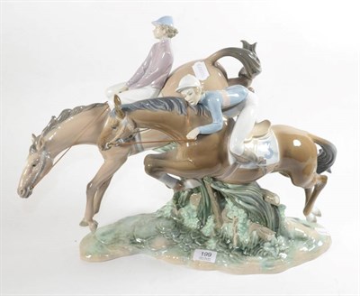 Lot 199 - A large and rare Lladro figure group of jockeys and race horses jumping a fence, impressed mark...