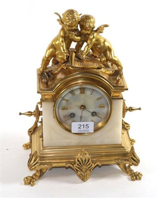 Lot 215 - A gilt metal onyx striking mantle clock circa 1900, with pendulum