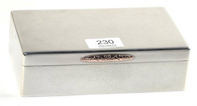 Lot 230 - An engine turned silver cigarette box, S J Rose & Son, Birmingham 1965, with gold coloured...