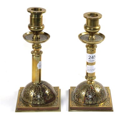 Lot 245 - A pair of Renaissance revival brass and tortoiseshell candlesticks