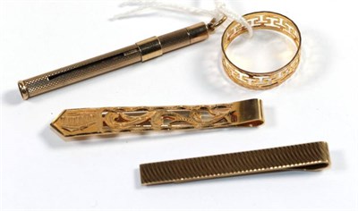 Lot 255 - A 9 carat gold toothpick; a 9 carat gold tie clip; another tie clip stamped 'K14'; and a...