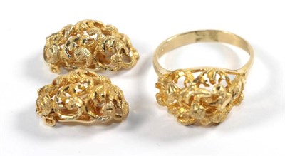 Lot 260 - An abstract ring, finger size S and a pair of matching earrings, with clip fittings, stamped '585'