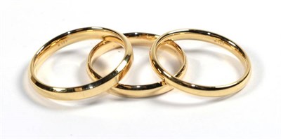 Lot 272 - Three 18 carat gold band rings, finger sizes M, M1/2 and O (3)