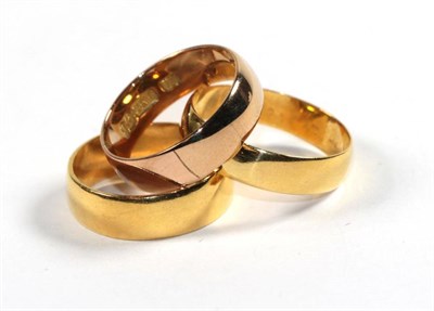 Lot 283 - Two 22 carat gold band rings, finger sizes L and P; and a 9 carat gold band ring, finger size...