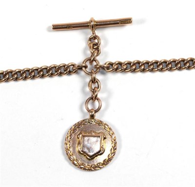 Lot 286 - A curb linked watch chain with attached T-bar and medal, stamped '9' .'375'