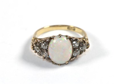 Lot 288 - An opal and diamond dress ring, stamped '18CT', finger size O1/2