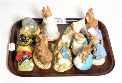 Lot 318 - A group of twelve Royal Albert Beatrix Potter figures including: The Christmas Stocking;...