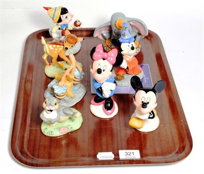 Lot 321 - A group of eight Royal Doulton Disney figures including Mickey Mouse; Bambi; Dumbo and Pinnochio