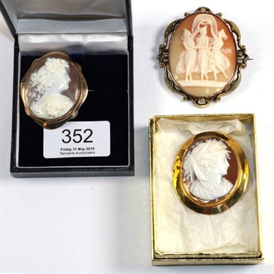 Lot 352 - Three cameo brooches, one depicting the three Graces, within a scrolling frame, measures 5.5cm...