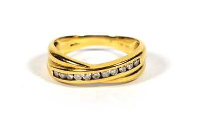 Lot 406 - A 9 carat gold diamond crossover ring, finger size Q