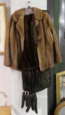 Lot 1106 - A fur coat together with a fur scarf