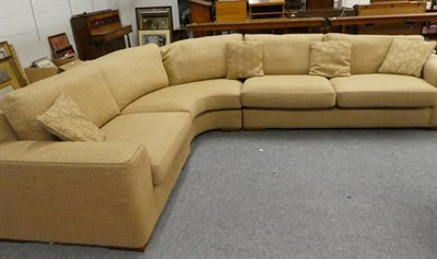 Lot 1129 - A corner sofa upholstered in oatmeal fabric