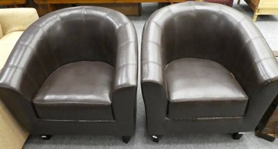 Lot 1130 - A pair of modern leatherette tub chairs