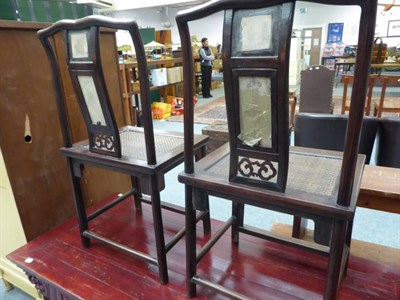 Lot 1133 - Two Chinese chairs and a Chinese coffee table (3)