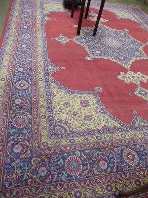 Lot 1155 - A large Isparta carpet, the blood red field centred by a medallion framed by spandrels and...
