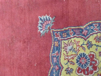 Lot 1155 - A large Isparta carpet, the blood red field centred by a medallion framed by spandrels and...