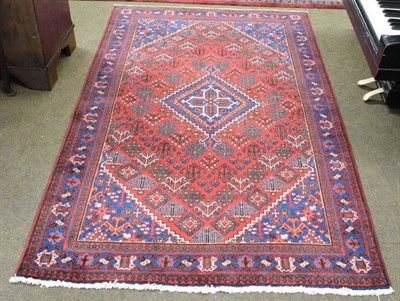 Lot 1161 - Joshaghan rug, the field centred by a stepped medallion enclosed by spandrels and indigo...
