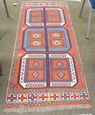 Lot 1164 - Quchan rug, the rust field with three octagons enclosed by narrow borders, 192cm by 85cm